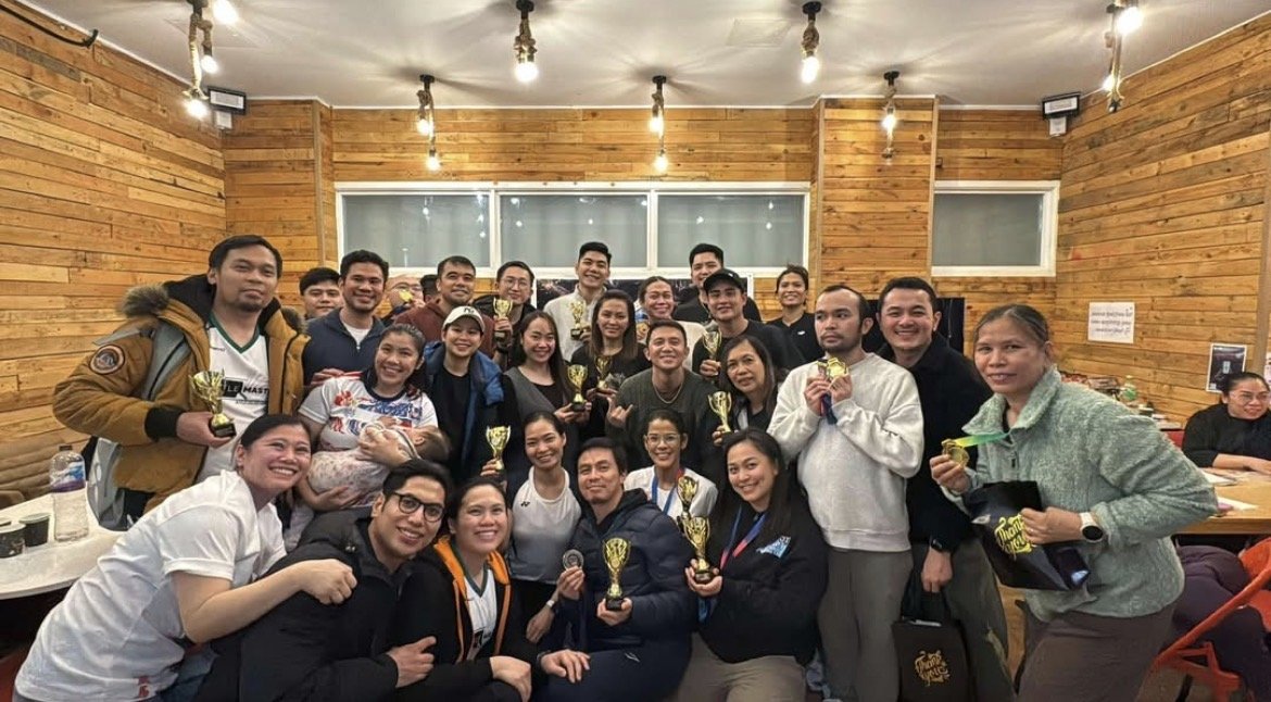 Club members celebrating with trophies and medals